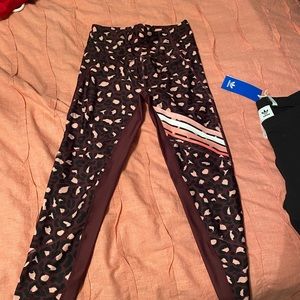 cropped purple and pink active wear leggings